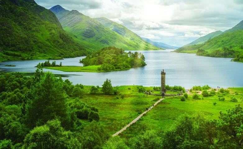 A view of a misty Scottish loch and highlands